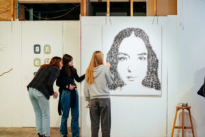 Crowds enjoying BUFFET: An Art Feast exhibition featuring works by female and non-binary artists. Photo by Assemble Photography.