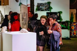 Crowds enjoying BUFFET: An Art Feast exhibition featuring works by female and non-binary artists. Photo by Assemble Photography.