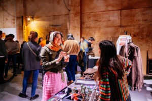 Crowds enjoying BUFFET: An Art Feast exhibition featuring works by female and non-binary artists. Photo by Assemble Photography.