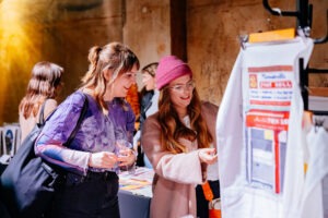 Crowds enjoying BUFFET: An Art Feast exhibition featuring works by female and non-binary artists. Photo by Assemble Photography.