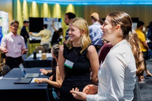 Participants engaging with project briefs and presentations at EWB Challenge 2024. Photo by Assemble Photography.