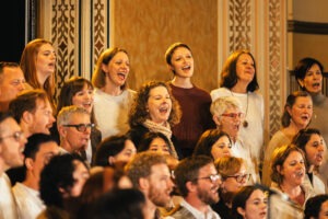Full choir of Inner West Voices on stage at Petersham Town Hall. Photo by Assemble Photography.