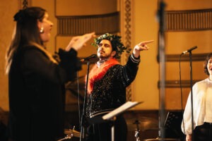 Brendan Maclean performs alongside Inner West Voices. Photo by Assemble Photography.