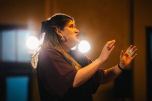 Inner West Voices conductor giving final notes to choir before performance. Photo by Assemble Photography.