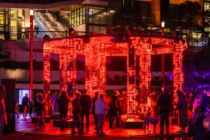 Crowds enjoy light displays and live music at Vivid Sydney 2024 in Tumbalong Park. Photo by Assemble Photography for Orbit.
