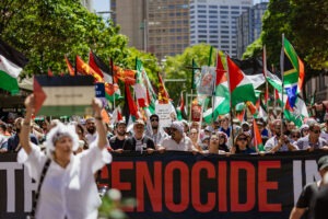 Protesters with Palestinian flags at pro-Palestine rally in Sydney, February 2024. Photo by Assemble Photography.