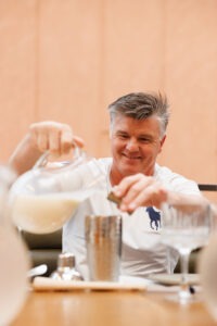 Guests preparing drinks at the mocktail masterclass, Volcanos Steakhouse, Stockland Wetherill Park. Photo by Assemble Photography.