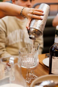 Guests preparing drinks at the mocktail masterclass, Volcanos Steakhouse, Stockland Wetherill Park. Photo by Assemble Photography.