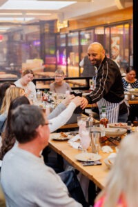 Guests preparing drinks at the mocktail masterclass, Volcanos Steakhouse, Stockland Wetherill Park. Photo by Assemble Photography.