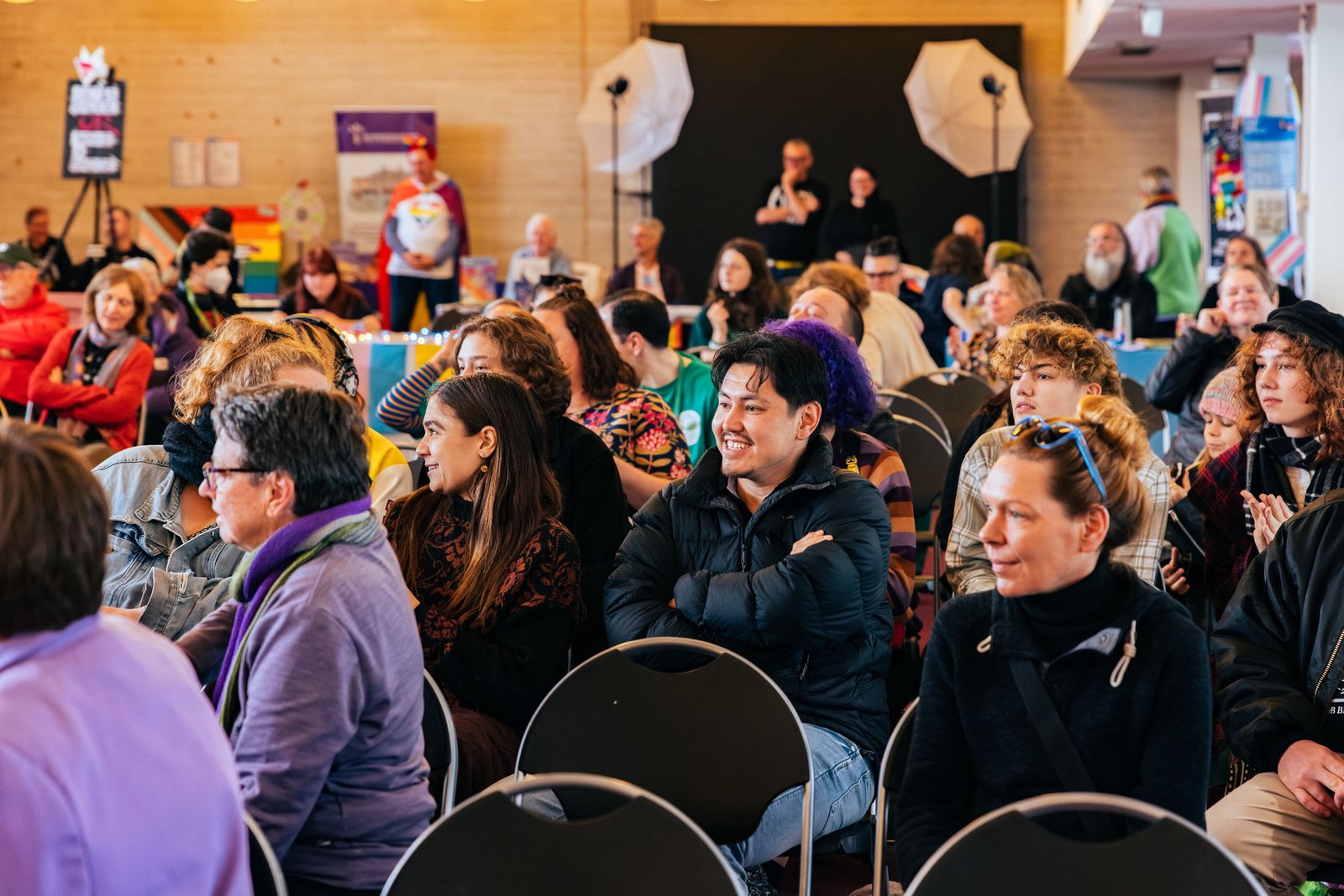Audience seated at an indoor IDAHOBIT community event