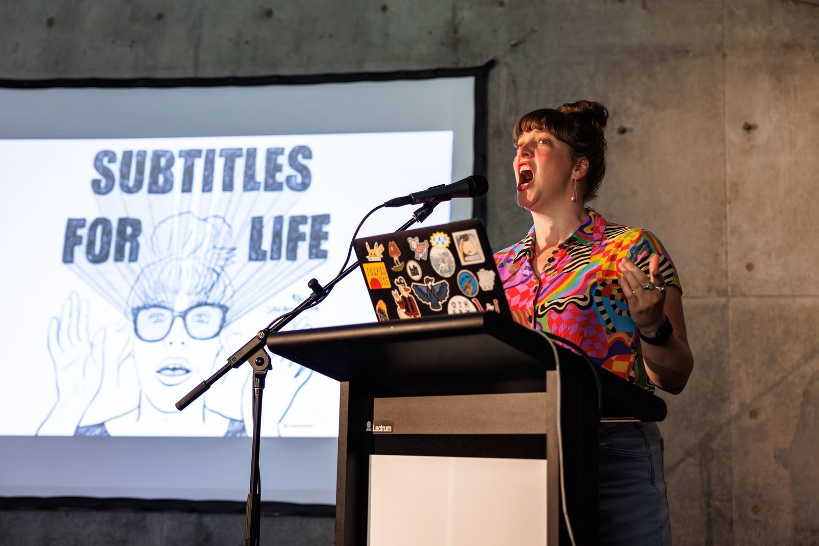 Sarah Firth reading at a lectern during the Read To Me Storytelling Event at Bundanon
